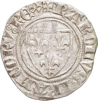 a silver coin with a lion on the front of it