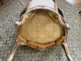 a chair that is sitting on a rug in a living room