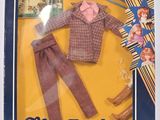 une poupée Barbie dans une boîte, avec des vêtements et des accessoires pour poupée