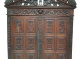 an old wooden cabinet with two birds on top of it