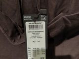 a close up of a brown jacket with a tag on it