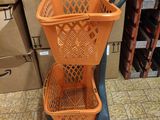 a shopping cart with a basket on top of it in a store