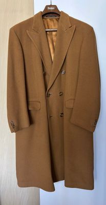 an image of a coat hanging on a hanger in a room
