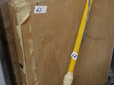 a yellow hose that is next to a door