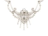 a close up of a necklace on a white background