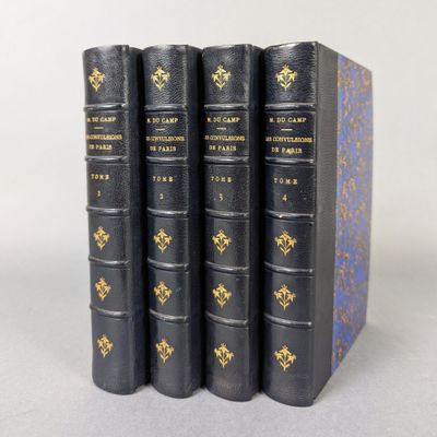 four books are lined up in a row on a table