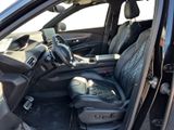 the interior of a car with the door open and the driver seat down