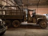a military truck that is parked in a garage