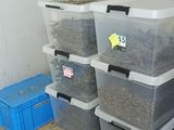 a stack of plastic containers sitting on the floor