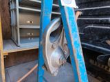 a close up of a blue ladder with a metal object on it