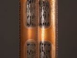 a close up of a metal object with holes in it