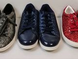 four pairs of shoes are lined up in a row