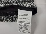 a black and white picture of a purse with a price tag