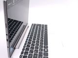 two laptops sitting side by side on a white surface