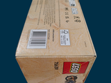 a cardboard box that has a sticker on it