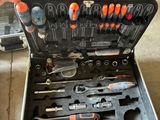 a tool case with tools in it sitting on the floor