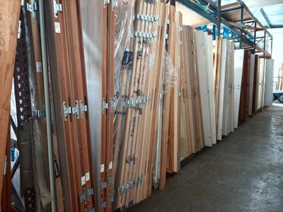 many different types of wood planks in a warehouse
