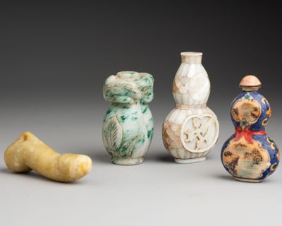 three small vases are sitting next to each other on a table