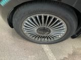 a close up of a car ' s tire on a parking lot
