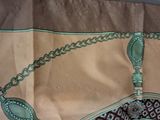 a piece of cloth with a design on it on a table