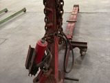 an image of a large chain attached to a fork in a warehouse