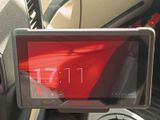 a picture of a car dashboard with a tablet on it