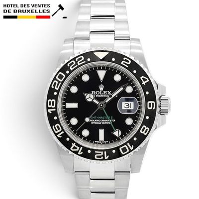 a close up of a wrist watch with a black dial