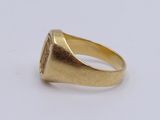 an image of a gold signet ring with a diamond set in the center