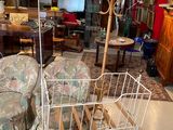 a white wrought iron bed in the middle of a living room