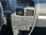 dashboard view of a car with a steering wheel and dashboard controls