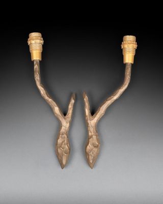 pair of bronze candlesticks with leaves and leaves on them