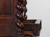 a close up of a wooden dresser with a mirror on top of it