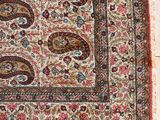 a close up of a rug hanging on a wall