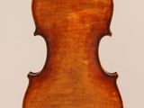 an old violin with a wooden back and a long neck