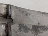 a knife that is laying on a table