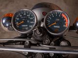 two gauges on the handlebars of a motorcycle