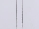 a close up of a pair of silver necklaces on a white surface