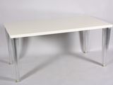 a small white table with clear legs on a white background