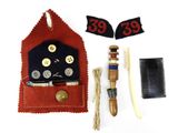a picture of a sewing kit with buttons and a comb