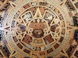 a clock made of wood with a face on it