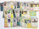 a lot of pokemon cards on the table together
