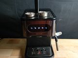 a coffee machine that is sitting on a wooden table