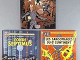 three books on a table with one of them in french and the other in french