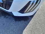 a close up of a car ' s front bumper and grille