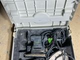 a tool box with tools inside of it on the floor
