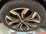 the wheels of a car are painted black and gold