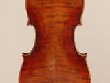 an old violin with a wooden back and a long neck
