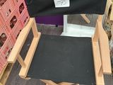 a black director ' s chair in a store