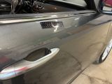 a close up of a car door handle with a sticker on it