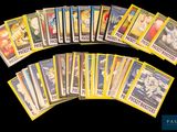 a lot of pokemon trading cards on a black background